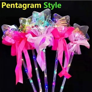 Macro view of five glowing star magic wands with colorful LED lights and sequins