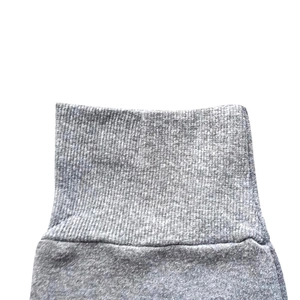 Close-up of the grey ribbed knit cuffs and high-density texture of the heavy sweatshirt