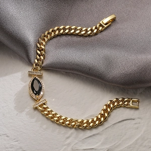 Elegant gold Cuban chain bracelet with black marquise stone and white zircon accents