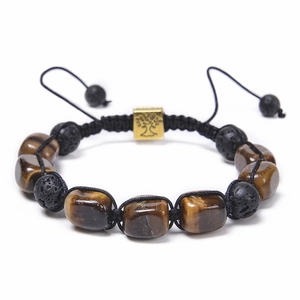Macro shot of adjustable beaded bracelet with lava stone, tiger eye and tree of life charm