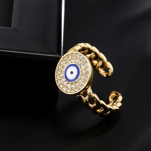 Golden curb chain open ring featuring a blue evil eye pendant with clear zircon inlay