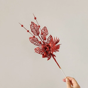 Close-up of red glittered lily decoration branch for Christmas tree ornaments