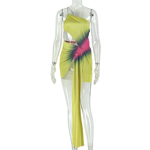 Detail of ruched neon green asymmetrical dress with cut-out and tie-dye satin fabric