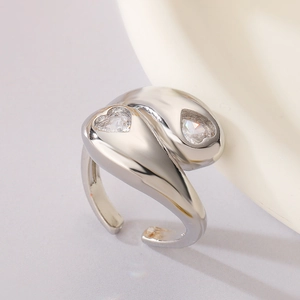 Close-up of silver open ring featuring two heart-shaped white cubic zirconia stones