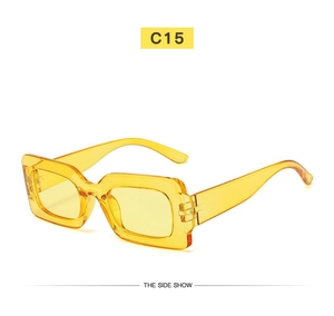 Detail view of vintage yellow transparent rectangle sunglasses frame and temple design