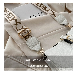 Close-up of adjustable golden buckle and beige jacquard strap on white leather bag