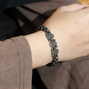 Retro punk skull motorcycle bracelet in stainless steel with vintage silver finish on wrist