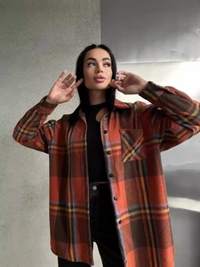 Oversized wool-blend plaid shirt in orange and brown tones for casual autumn street style