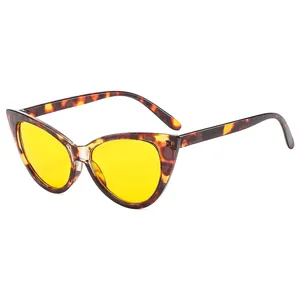Chic cat eye sunglasses with leopard print frames and yellow lenses from 45-degree angle