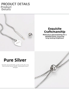 Macro detail of S925 sterling silver box chain with adjustable bead and heart charm