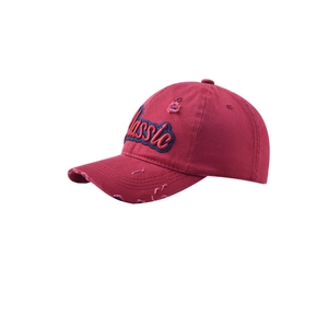 Close-up of red distressed baseball cap with blue-bordered Classic 3D embroidery detail