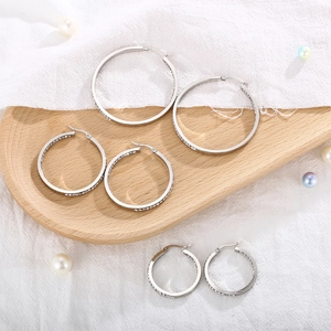 Silver stainless steel hoop earrings with sparkling cubic zirconia in three sizes