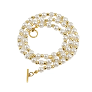 Elegant gold pearl toggle necklace with white round pearls and polished metallic beads