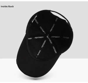 Detail of black baseball cap interior with branded narason seam tape and care label
