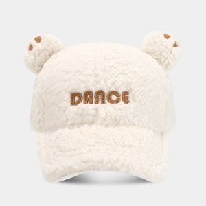 Close-up of white plush baseball cap featuring cute bear ears and DANCE embroidery detail
