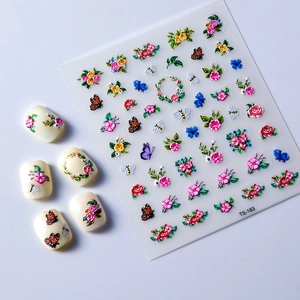 5D embossed nail stickers featuring colorful floral, butterfly, and bee designs on white tips