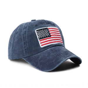 Vintage navy blue washed cotton baseball cap with embroidered American flag patch