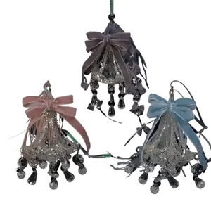 Elegant crystal chandelier ornaments with velvet bows in pink, grey, and blue colors