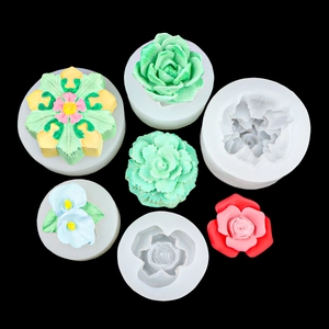 Floral silicone molds for fondant showing rose and succulent shapes with colorful finished crafts