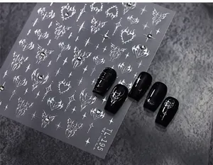 Detailed view of TL-195 metallic silver 3D gothic nail stickers with butterfly and star motifs