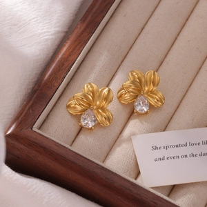 Golden flower-shaped titanium steel earrings with a pear-cut zircon stone centerpiece