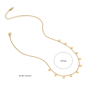 Detailed view of golden necklace with floral pendants featuring 40+5cm length and 5g weight