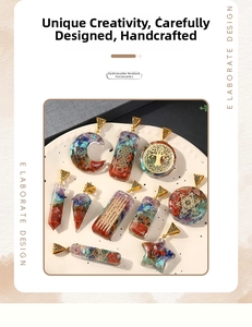 Detail of colorful resin pendants with natural crushed crystals and golden mystical symbols