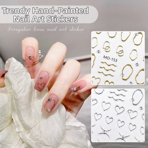 Macro view of metallic geometric lines and rhinestones nail art stickers on nails