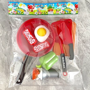 Detailed view of 9pcs kids kitchen toy set with pan and food models in retail packaging
