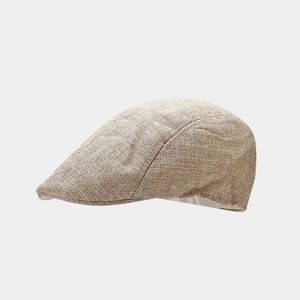Close-up of khaki linen ivy cap showing breathable textured fabric and fine weave detail
