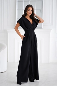 Detailed view of black deep V-neck jumpsuit with waist-cinching and wide-leg design