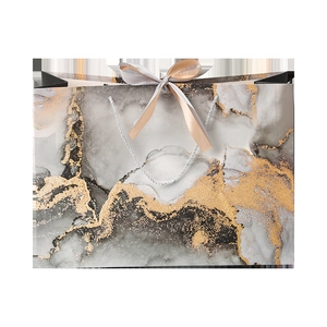 Gray marble pattern gift bag with gold foil texture and elegant ribbon handles
