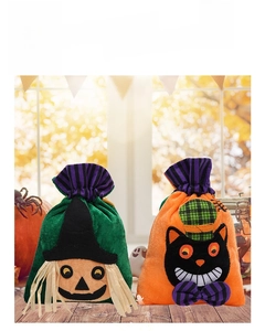 Detail view of plush Halloween gift bags featuring cartoon witch and black cat designs