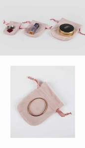 Various sizes of pink velvet drawstring pouches for jewelry storage and organization