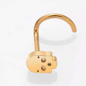 Gold stainless steel skull nose stud with S-shaped curved bar on a white background