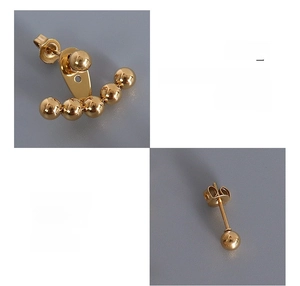 Detailed view of surgical steel gold earrings with a 3-hole adjustable back design