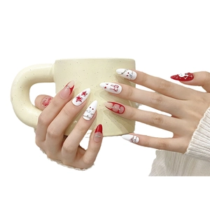 Handmade press-on nails featuring cute bunny graffiti, red French tips and star designs