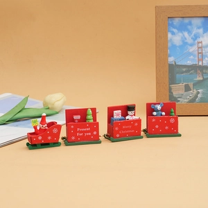 Detail of red wooden four-car Christmas train with Merry Christmas prints and mini figures