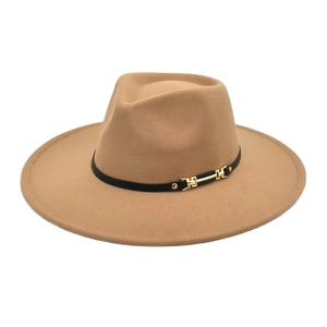 Close-up of camel wide-brim fedora hat with black leather band and gold metal buckle