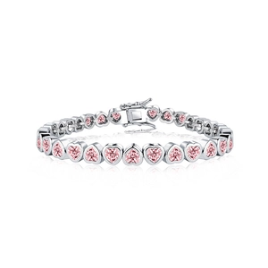 Macro shot of pink heart-shaped cubic zirconia stones on silver plated tennis bracelet