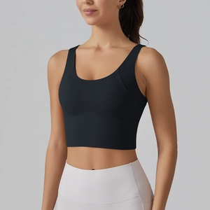 Close-up of a black crop top and white high-waist yoga leggings for fitness and running