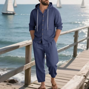 Close-up of deep blue linen blend fabric on relaxed fit men's hooded beach set