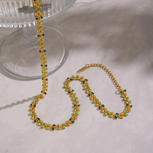 Vintage 18K gold plated stainless steel necklace with green enamel leaf shaped links