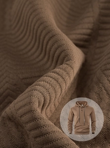 Macro shot of wavy knit texture on brown men's hoodie with hood and drawstring detail