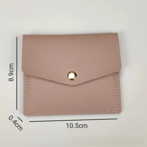 Slim pink faux leather card holder detail showing dimensions 10.5cm by 8.9cm by 0.4cm