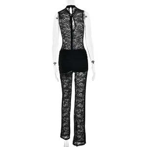 Rear view of black lace jumpsuit featuring floral hollow patterns and pleated details