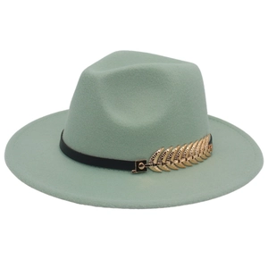 Detail of mint green fedora hat featuring a black band and gold feather ornament