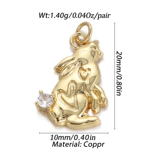 Macro view of gold bunny pendant with heart carving and measurements for DIY jewelry