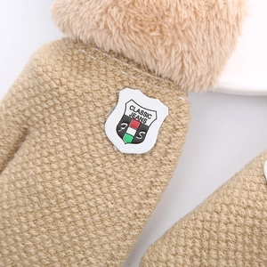 Brown knitted winter gloves for toddlers with warm fleece lining and shield logo patch