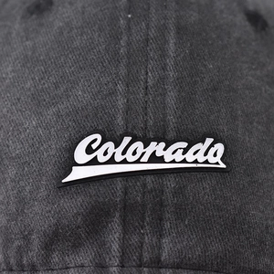 Washed cotton baseball cap in grey with a 3D Colorado script label for a vintage look